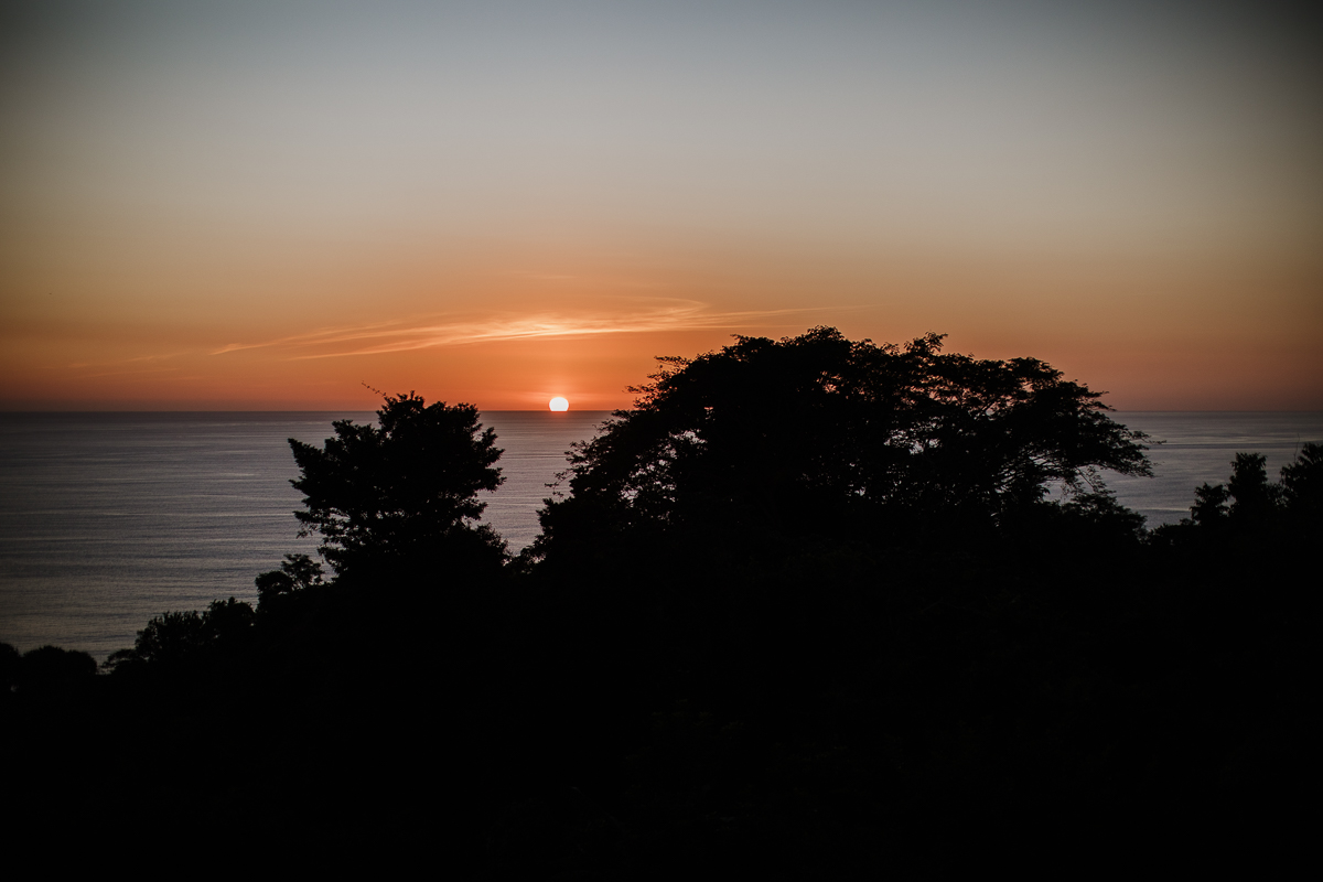 sunset over the ocean in costa rica